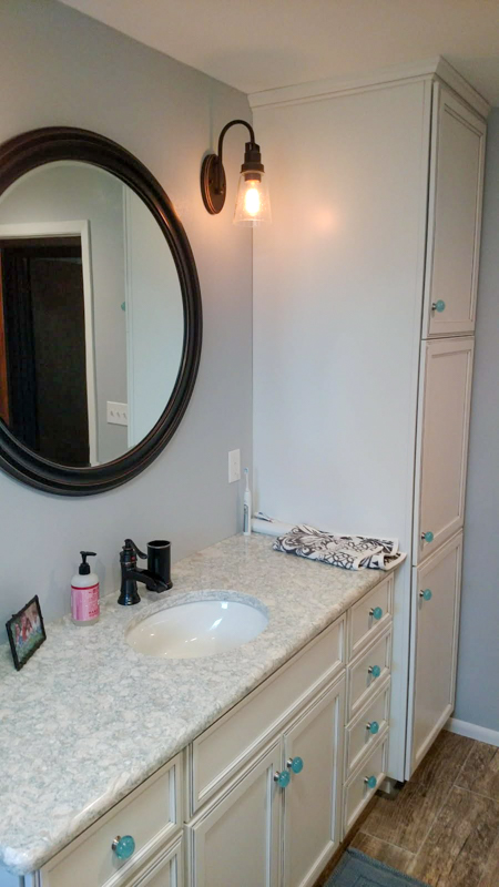 Bathroom vanity with tall linen cabinet in Hayden, Idaho