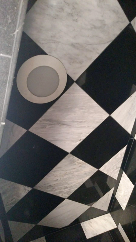 Marble checkerboard bathroom floor in Hayden, Idaho